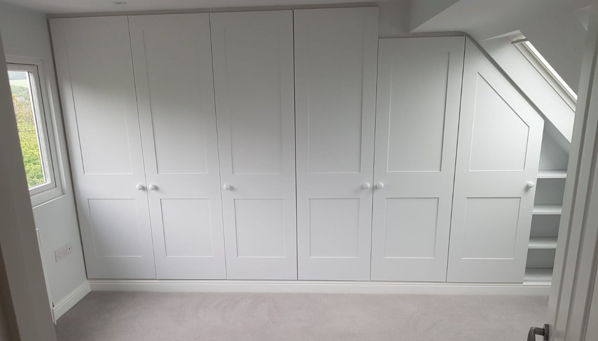 Bedroom wardrobe/storage with closed doors